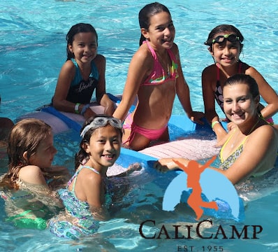 Campers and their camp counselor swimming in the pool at Cali Camp Summer Day Camp in Los Angeles